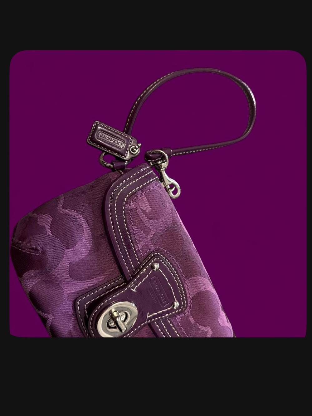 Coach Plum Signature Turn-Lock Wristlet